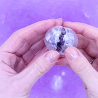 Bomba de baño con pulsera de gemas de amatista