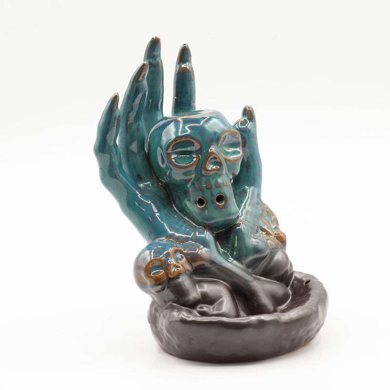 Quemador de incienso de flujo inverso - Calavera en la mano