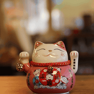 Gato de la suerte de cerámica con mano móvil - Rosa sobre cojín (pilas no incluidas)